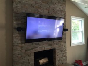 TV mounted on fireplace (after)